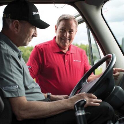 man behind steering wheel